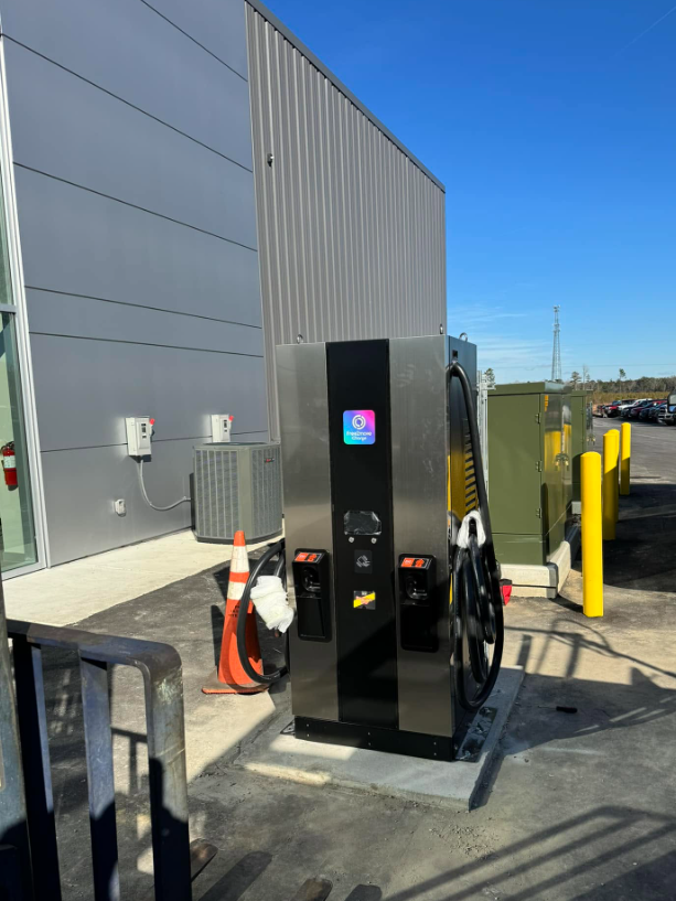 EV charging station beside a commercial building with transformer