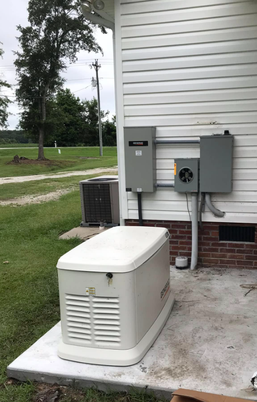 Generac generator with transfer switch and panel on a home exterior