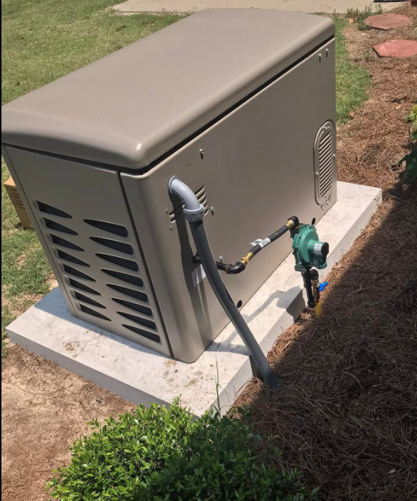 Standby generator on concrete pad with gas regulator and piping
