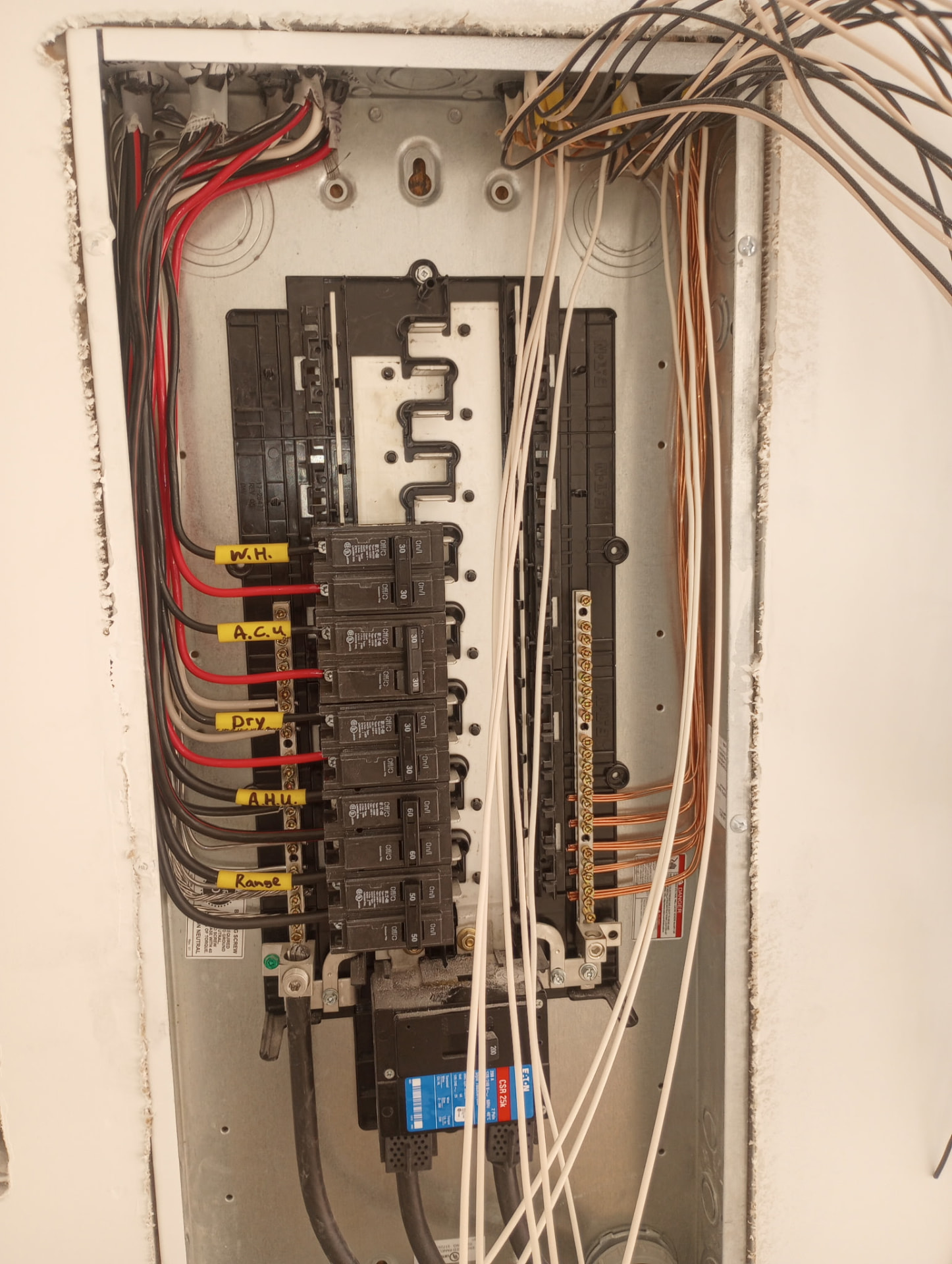 Open 200 amp electrical panel with neatly dressed and labeled circuits